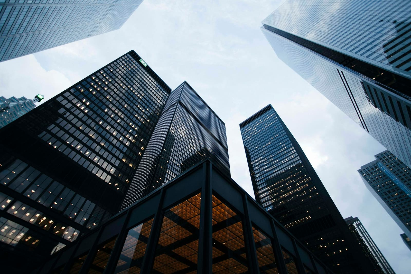 Looking up at glass towers against the sky